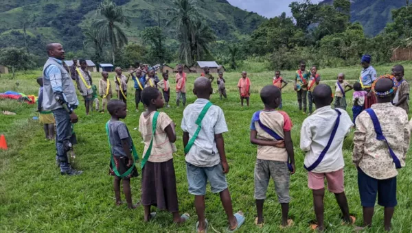 Children standing in a circle in DRC playing
