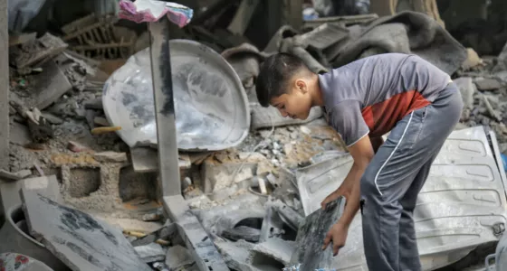 Child sorting through the rubble in Gaza. 