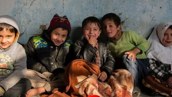 Children in Afghanistan smile at one of War Child's centres.