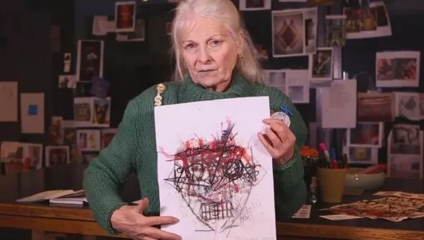 Vivienne Westwood holds up the artwork used on the #StopArmingSaudi campaign t-shirt.