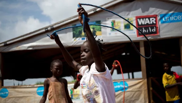 Participants smile as they play with skipping ropes in a War Child child-friendly space in the CAR.
