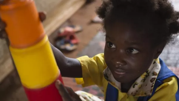 Child playing with building blocks in the Central African Republic.