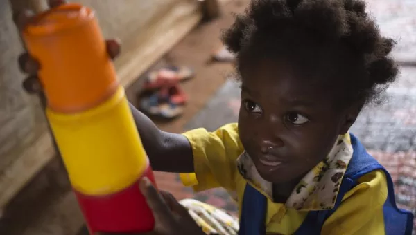 Child playing with building blocks in the Central African Republic.