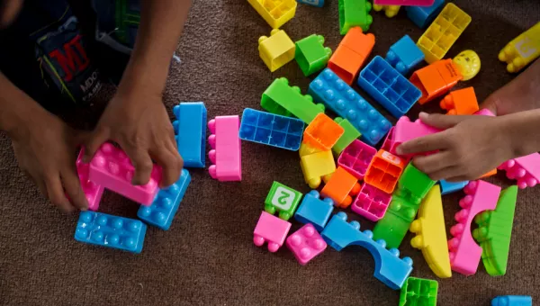 Children play with building blocks in a War Child child-friendly space in Iraq.