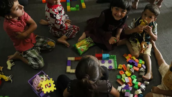 Child playing with building blocks in Iraq.