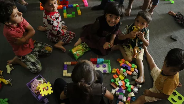 Children play with building blocks in a War Child child-friendly space in Iraq.