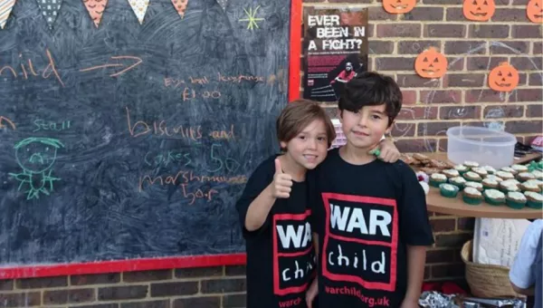 Pupils fundraising for War Child at school.