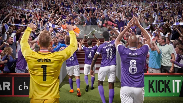 Football players from Sports Interactive's Football Manager hold up cup to cheering fans.