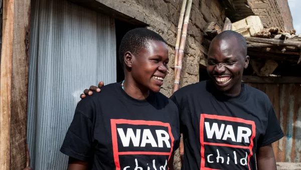 War Child staff members smiling.