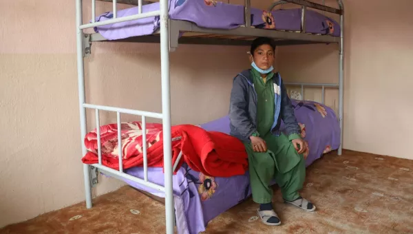Participant Jawad sits on the lower bunk bed at the War Child centre in Herat, Afghansitan.
