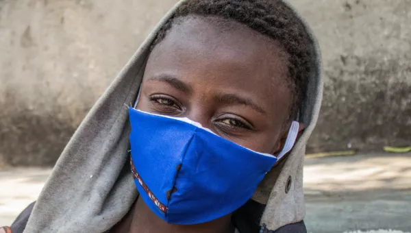 Participant Kanyere wearing a facemask given to him as part of War Child Covid-19 response in the Democratic Republic of Congo.