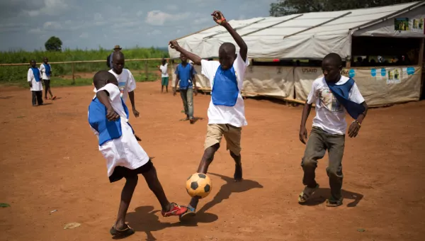 Boys play football outside a War Child centre in the Central African Republic.
