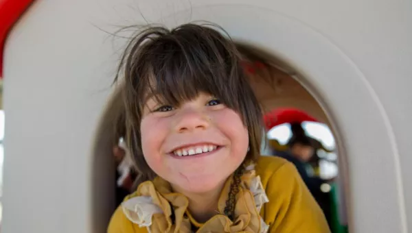 A child in a playhouse in Jordan. 