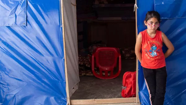 Soleen standing in front of building