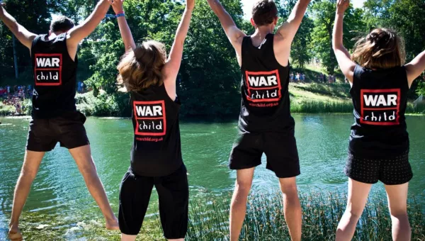 Team War Child supporters celebrate in their War Child tops