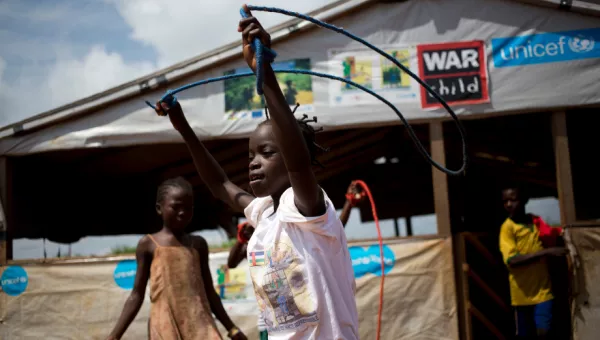 Children play with skipping ropes outside a War Child child-friendly space in the Central African Republic.