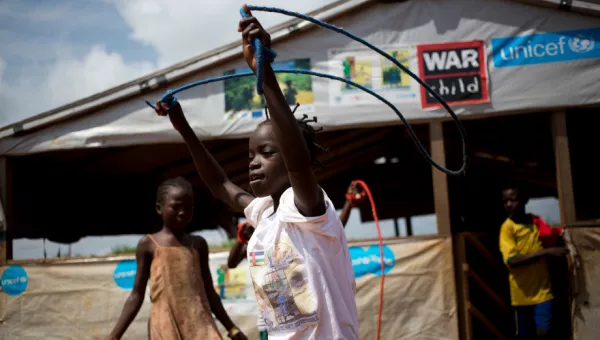 Children playing with skipping ropes outside War Child child-friendly space in the CAR.