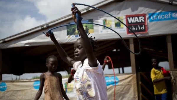 girl-playing-with-a-skipping-rope-outside-war-child-child-friendly-space