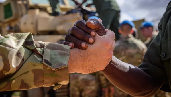 Close up of two people shaking hands.