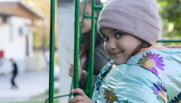 Girl playing in a playground in Moldova