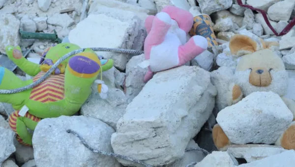 Childrens toys in the rubble from a destroyed building in Syria. 