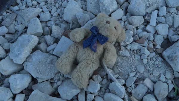 A childs teddy bear in the rubble of a colapsed building, Syria. 