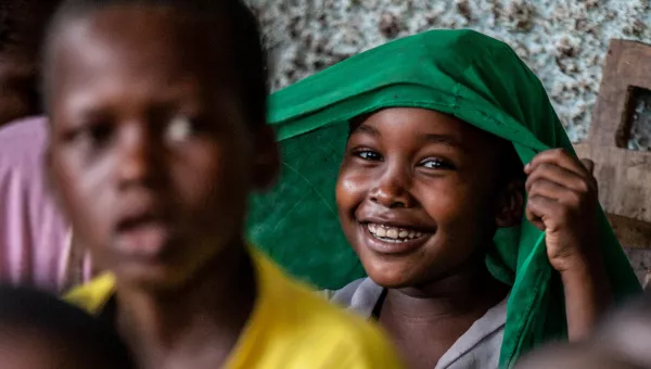 A young girl smiling in Central African Republic. 