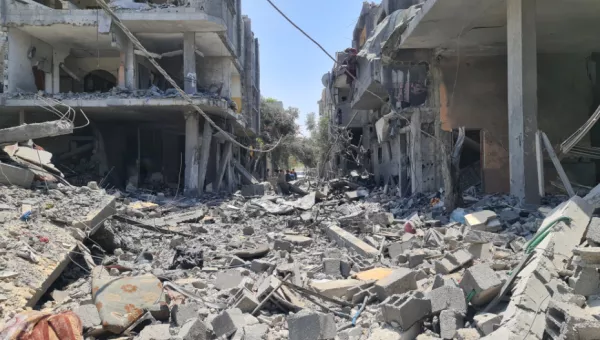 Destroyed buildings and rubble-filled street in Gaza.