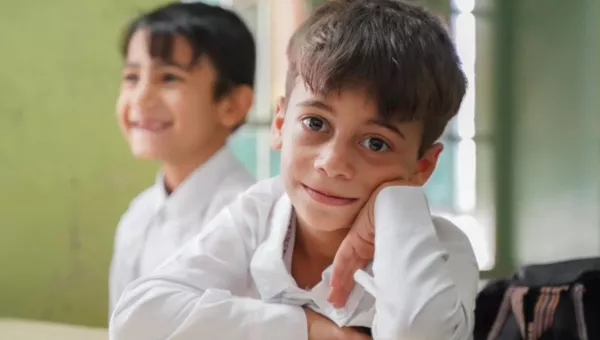 Child sitting in a classroom in Jordan.