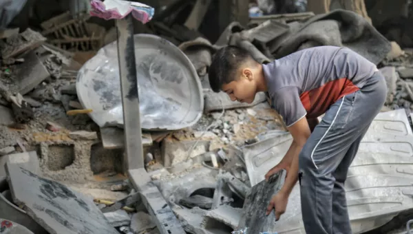 Child sorting through the rubble in Gaza. 