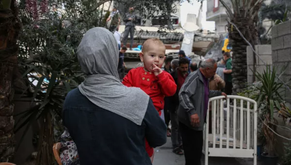 A mother and her child walking in Gaza.