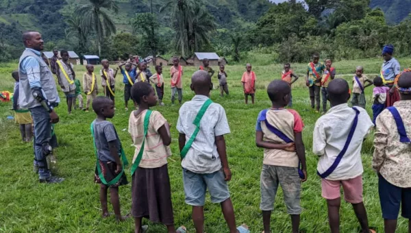 Children standing in a circle in DRC playing