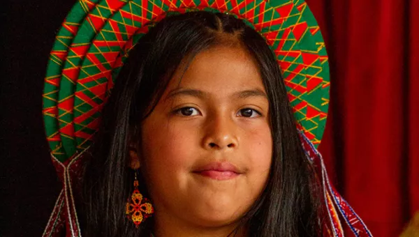 Girl from Colombia waering traditional clothing.
