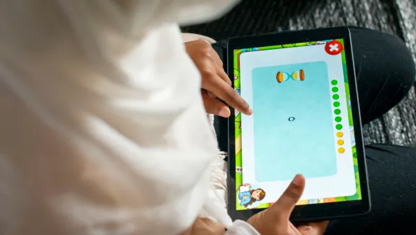 A child playing a Can't Wait to Learn game in Lebanon. 