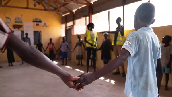 People holding hands.