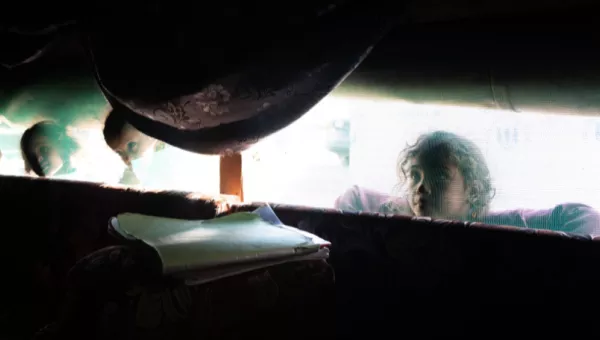 A girl looking through a window