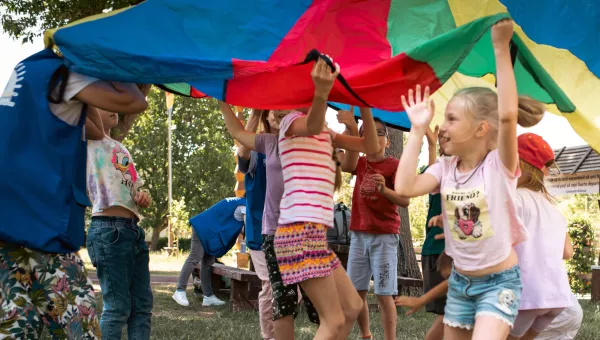 Children playing with a parachute in Ukraine.
