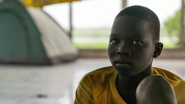 Sudanese boy looks into camera