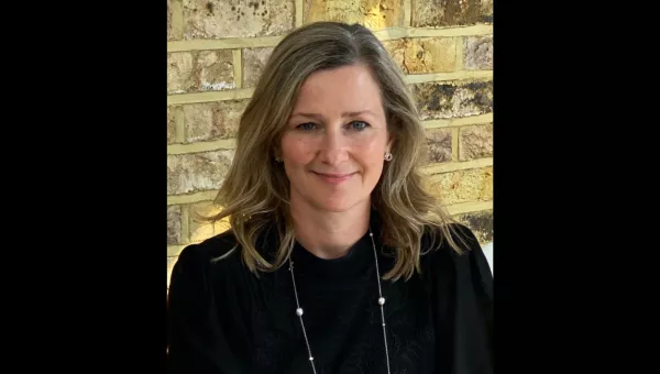 Headshot of Mel Exon