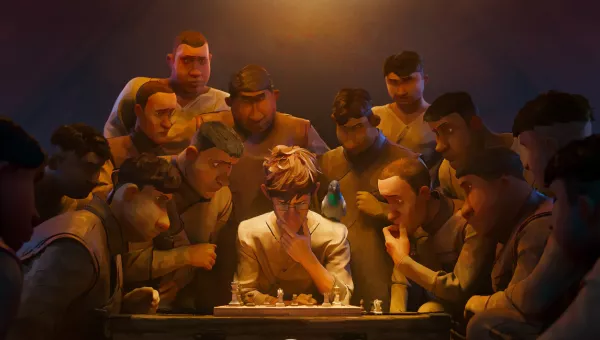 A man sat playing chess surrounded by a group of people watching.