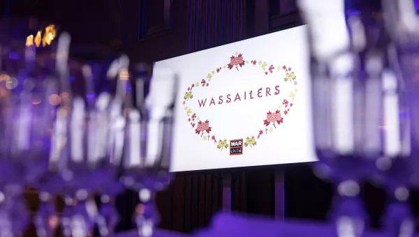 dinner glasses with wassailers table holder in the background