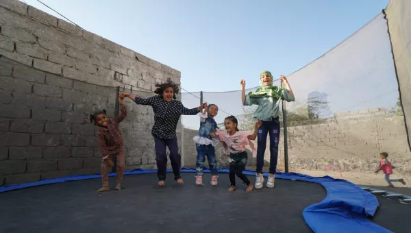 5 children jumping on trampoline