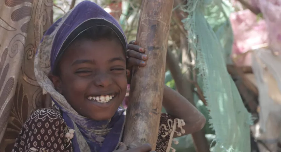 Saima smiling to the camera in Yemen. 