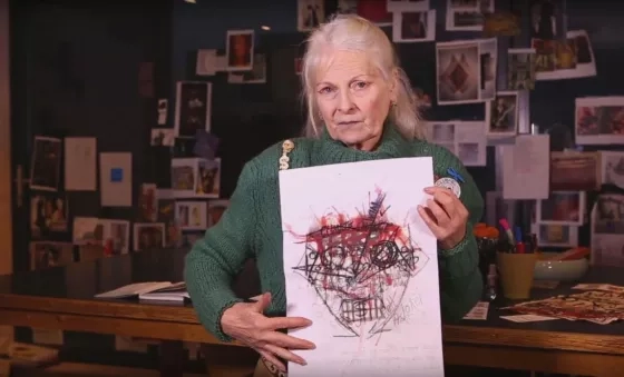 Vivienne Westwood holds the artwork printed on t-shirts made in collaboration with War Child.