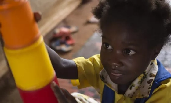 Child playing with building blocks in the Central African Republic.