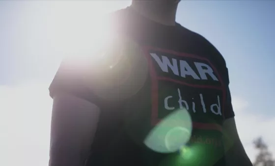 Runner wearing War Child t-shirt.