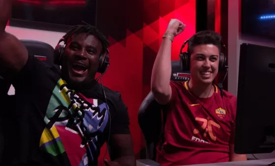 Gamers cheer as they play football gaming tournament for War Child.