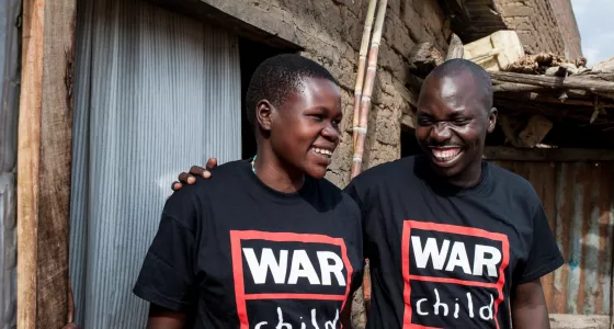 War Child staff members smiling.