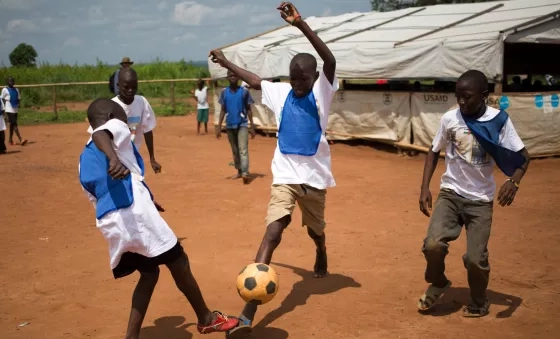 Boys play football outside a War Child centre in the Central African Republic.