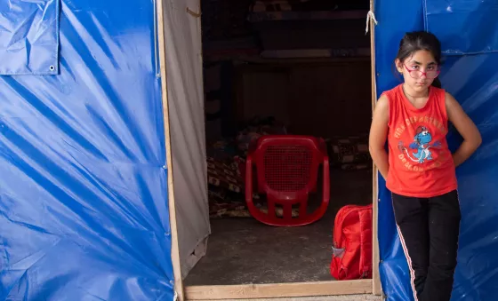 Soleen standing in front of building